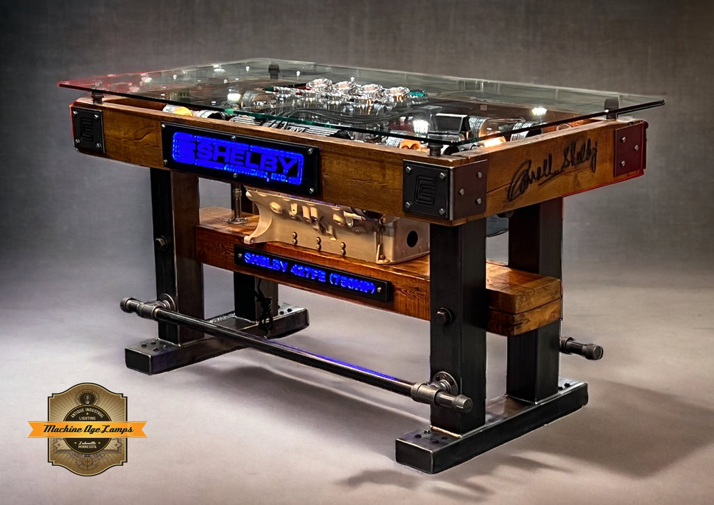 steampunk industrial table with automotive engine on display