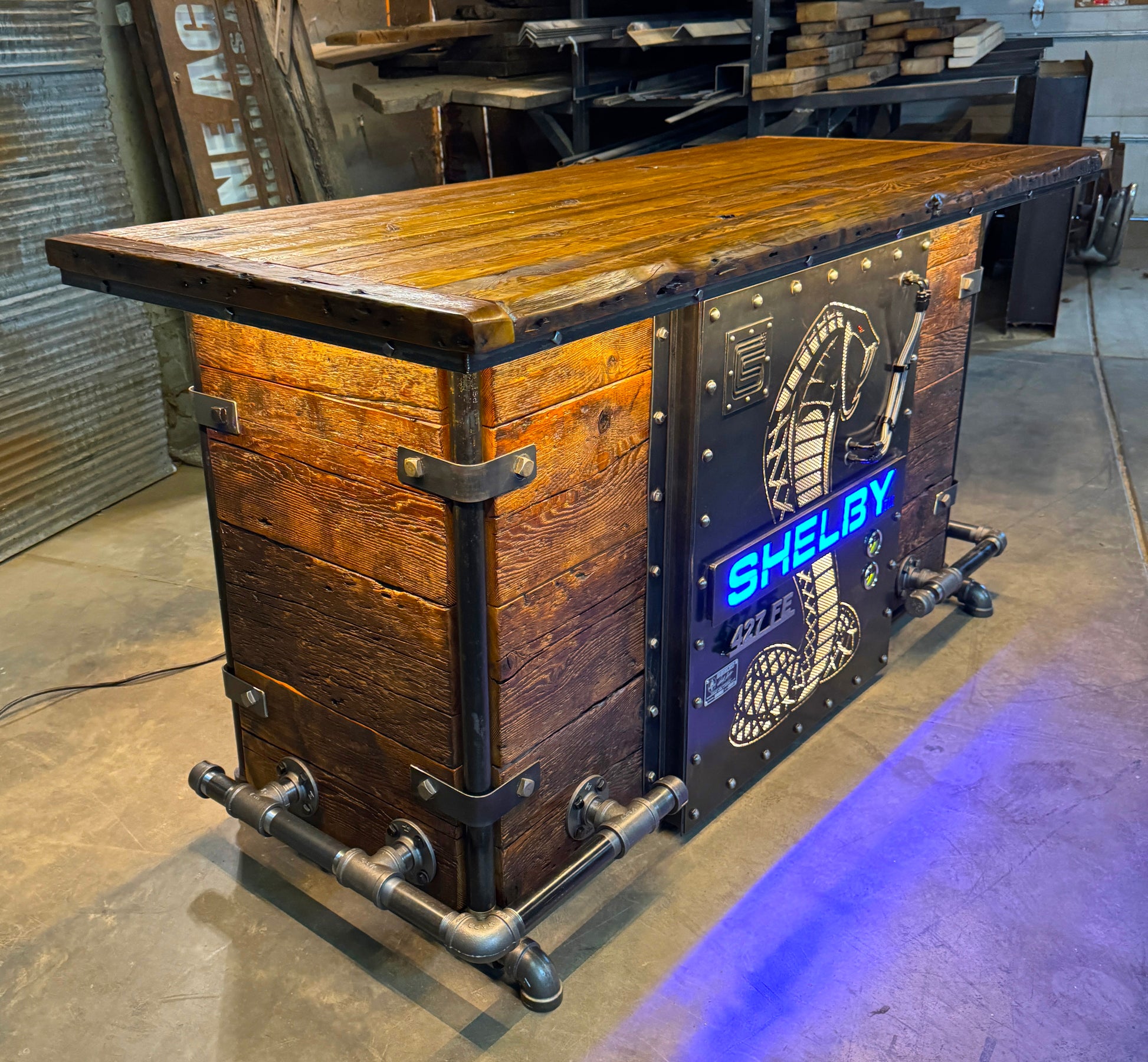 side view of Carroll Shelby Steampunk Industrial Refrigerator Bar with snake design