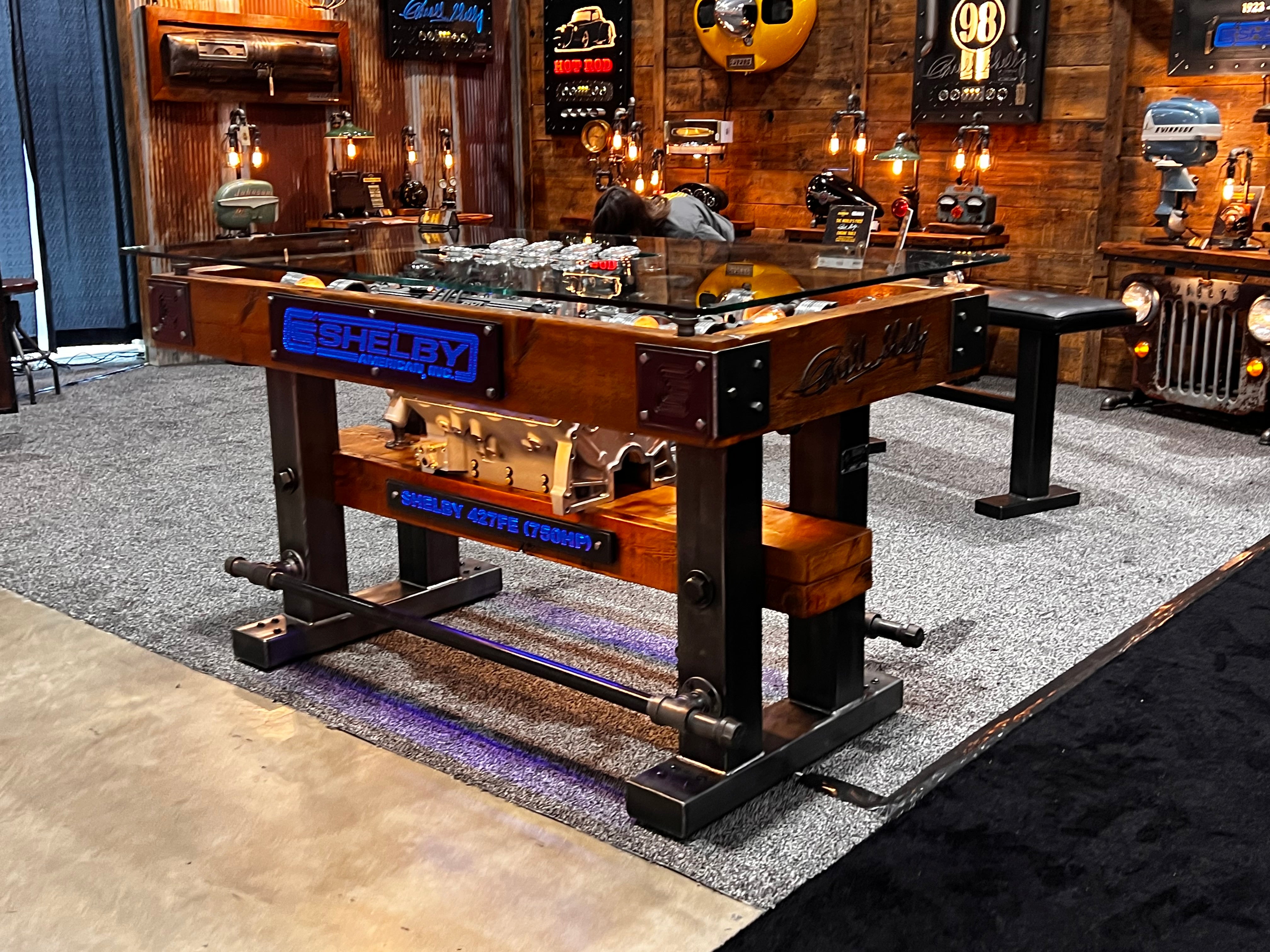 steampunk industrial table with automotive engine inside of steampunk room