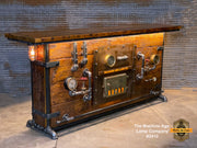 Custom made 8-foot steampunk industrial bar and hostess stand made from reclaimed barnwood.