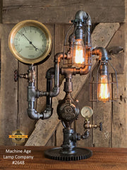 Handcrafted steampunk industrial machine age lamp #2648 with antique steam gauge and gear base.
