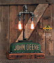 authentic John Deere radiator top with its original patina and a rustic barn wood base